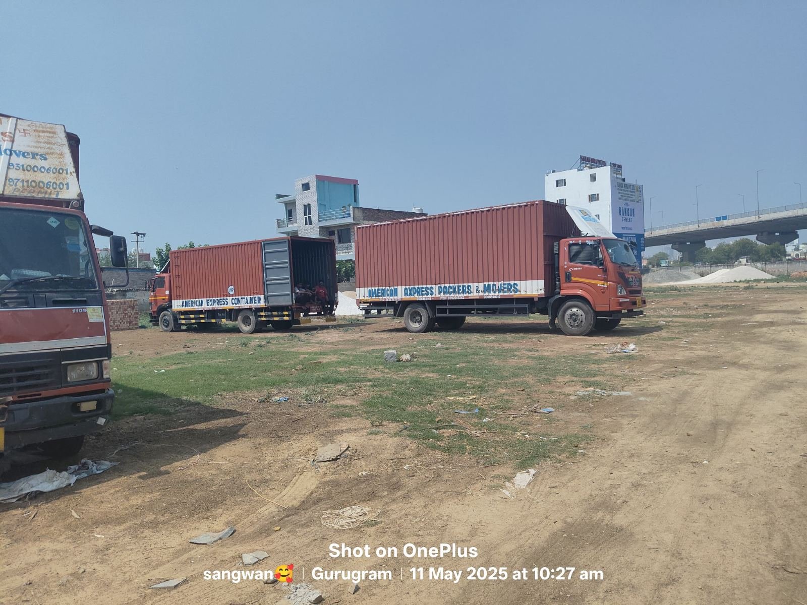 American Express Packers and Movers container truck fleet lined up in Gurugram