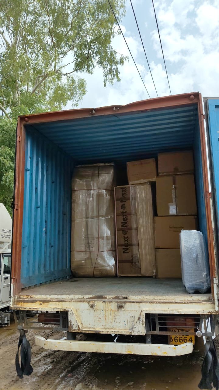 Wrapped household goods and furniture loaded securely in a container