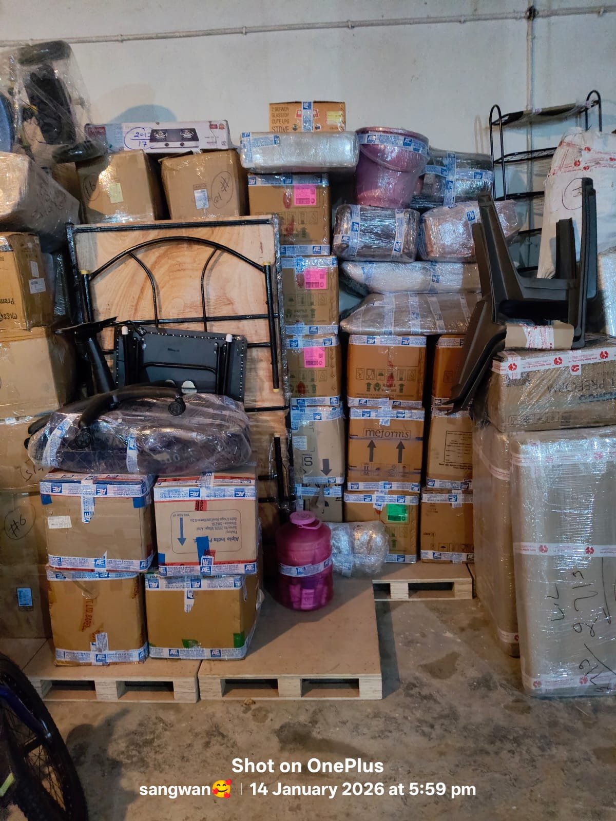 Labelled moving cartons and furniture loaded in a truck for house shifting