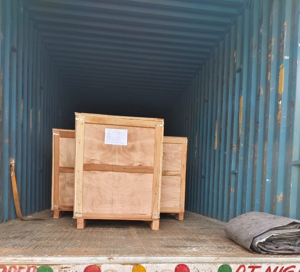 Heavy-duty wooden shipping crate secured inside a container